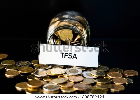 Bottle of coins with TFSA sign - Retirement and savings concept