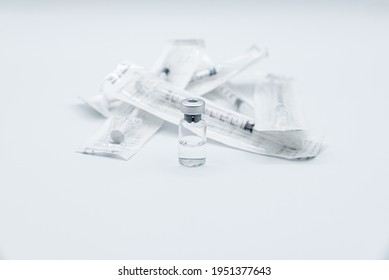 Bottle Of Drug Or Vaccine For Immunization Against The Covid-19 Corona Virus. Preparing The Syringe For Injecting The First Or Second Dose Of Vaccine, Isolated On White Background.