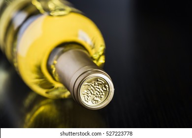 Bottle Of Dry White Wine On A Dark Background