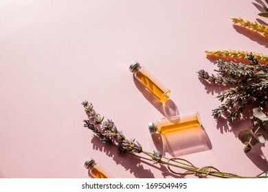 Bottle Of Essential Oil With Fresh Herbal Sage, Lavander.flat Lay On Pink Background.Healthy Oil.The Concept Of A Healthy Vegetarian Diet, Detox.Alternative Medicine, Phytotherapy, Herbal Treatment.