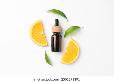 Bottle of essential oil, orange and green leaves on white background, flat lay