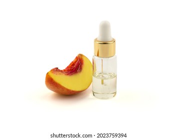 Bottle With Essential Oil Or Serum And Fresh Peach Wedge On White Background