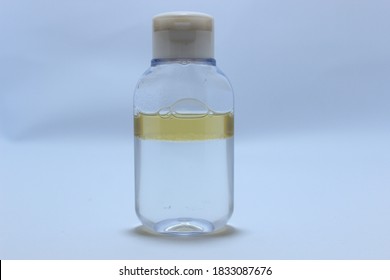 
Bottle Filled With Facial Makeup Remover On White Background.