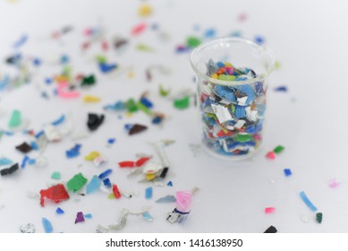 Bottle Flake,PET Bottle Flake,Plastic Bottle Crushed,Small Pieces Of Cut Colorful Plastic Bottles In Beaker Glass