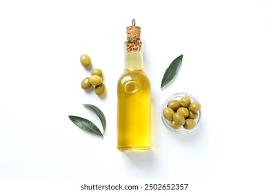 Bottle of fresh olive oil and olives with leaves on white background