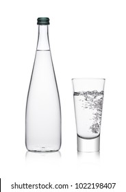 Bottle And Glass With Healthy Sparkling  Water Lemonade With Bubbles On White