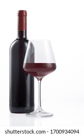 Bottle and glass of Spanish red wine on  white background 
