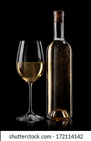 Bottle And Glass Of White Wine On A Black Background