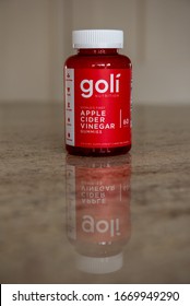 A Bottle Of Goli Apple Cider Vinegar Gummies Sitting On Kitchen Granite Countertop As The New Staple In Daily Supplements On March 10, 2020