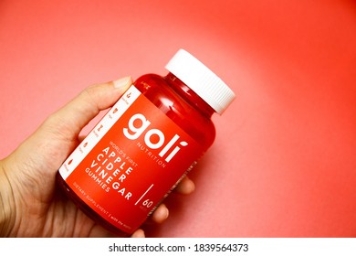 A Bottle Of Goli Apple Cider Vinegar Gummies On Red Background As The New Staple In Daily Supplements On June 15, 2020