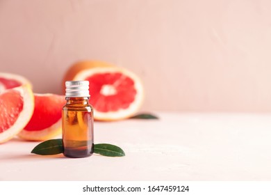 Bottle Of Grapefruit Essential Oil On Table