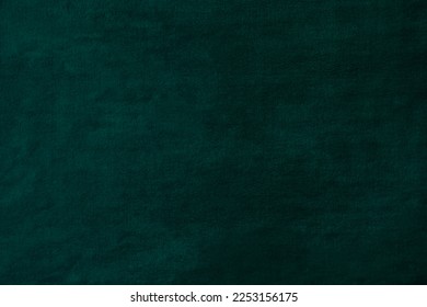Bottle green velvet uneven background for design or photography backdrop. Malachite green uneven texture can be used as canvas or banner with space for logo or design. Arkistovalokuva