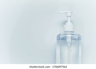 A Bottle Of Hand Sanitizer And Stack Of Medical Mask With White Background