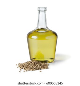 Bottle With Hemp Oil And Unshelled Hemp Seed On White Background