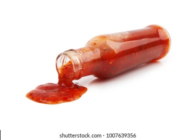 Bottle Of Hot Sauce Is Spilling Liquid On White Background