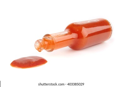 Bottle Of Hot Sauce Is Spilling Liquid On White Background