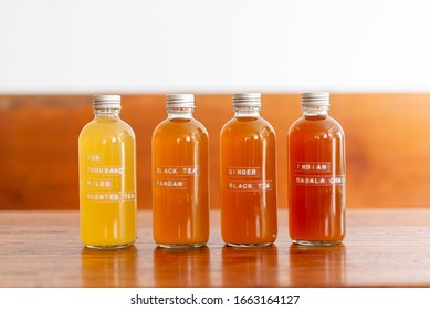 bottle of Kombucha variety probiotic drink on wooden table background.