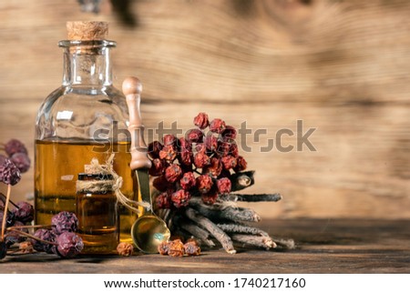 Bottle of magic potion on the witch doctor table close up.