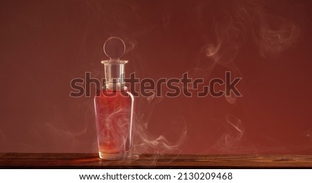 bottle with magic potion in smoke