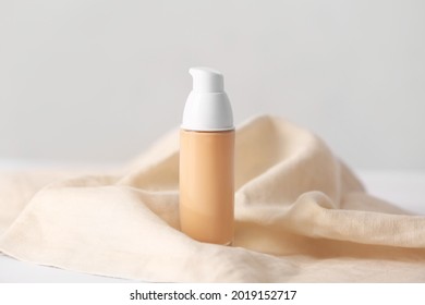 Bottle Of Makeup Foundation On Light Background