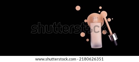 Bottle of makeup foundation and samples on black background. Liquid foundation cream unbranded bottle. BB cream for professional make-up, eyedropper for applying. Mock up concept