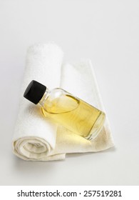 Bottle Of The Massage Oil On The Face Towel