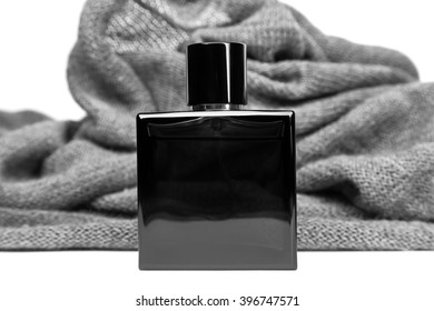 Bottle Of Men Perfume And Gray Scarf