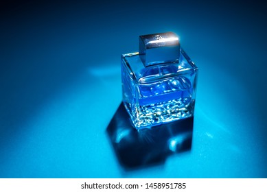 Bottle Of Men's Fragrance On A Dark Blue Background