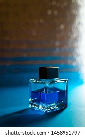 Bottle Of Men's Fragrance On A Dark Blue Background