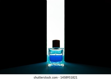 Bottle Of Men's Fragrance On A Dark Blue Background