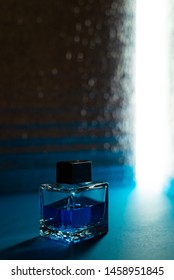 Bottle Of Men's Fragrance On A Dark Blue Background