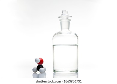 A bottle of methanol with its chemical structure. 