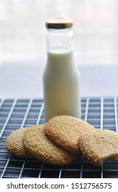 A Bottle Of Milk And Low Calories Sesame Biscuits : Healthy Lifestyle Concept (selective Focus Image)