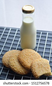 A Bottle Of Milk And Low Calories Sesame Biscuits : Healthy Lifestyle Concept (selective Focus Image)