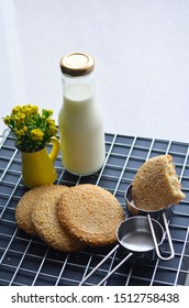 A Bottle Of Milk And Low Calories Sesame Biscuits : Healthy Lifestyle Concept (selective Focus Image)