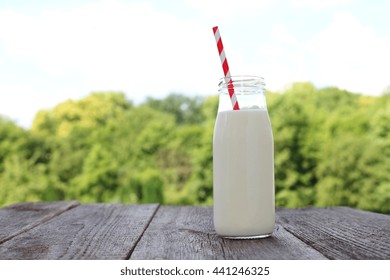 The Bottle Of Milk And Red Straw