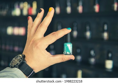 Bottle Of Nail Polish In A Man's Hand With Painted Nails A Man With Painted Nails. Design Of Male Nails. Men Manicure.