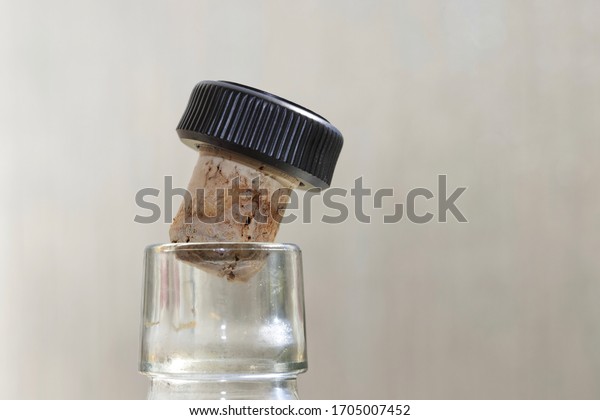 Bottle neck\
with cork stopper partially\
inserted