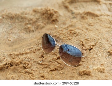 bottle with a note is reflected in sunglasses