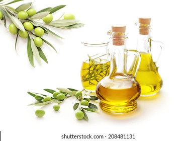 Bottle Of Olive Oil And Green Olives On White Background