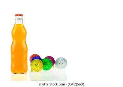 Bottle Of  Orange Fanta (coca Cola) Glass Soda And Christmas Decoration With Bauble Ball  On A White Background