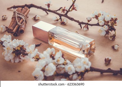 Bottle of perfume with apricot blossom, cinnamon and cloves