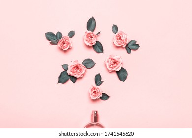 Bottle of perfume and roses flowers on pink background. Minimal beauty concept. - Shutterstock ID 1741545620