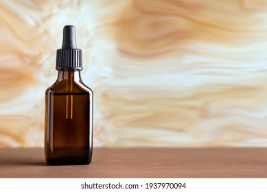 Bottle with a pipette on a beige background. Brown container with vitamins.