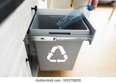 Bottle Recycle Bin In Kitchen. Plastic Garbage Sorting