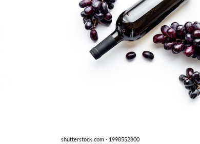 Bottle Red Wine Isolated With Bunch Of Grape. Overhead View