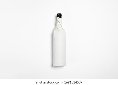 Bottle of Red Wine Mock-up wrapped in craft paper on white background.High resolution photo.