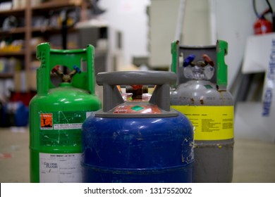 Bottle of refrigerant, for repair evaporators and condensers of air conditioners, used in industrial and commercial cold, gas concerned by the Kyoto Protocol, fight for the reduction of greenhouse gas - Shutterstock ID 1317552002
