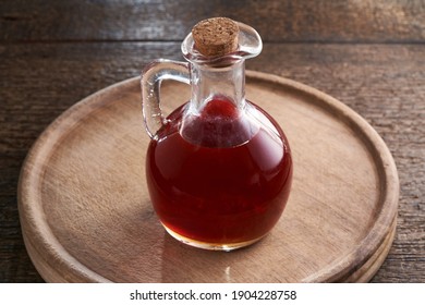 A Bottle Of Rose Hip Seed Oil On A Table