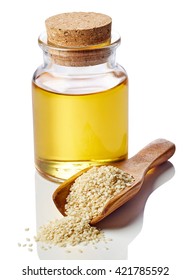 Bottle Of Sesame Oil And Sesame Seeds Isolated On White Background